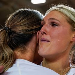 BYU’s Taylen Ballard-Nixon sheds a tear while embracing her teammate after winning against Utah in an NCAA volleyball game at Smith Fieldhouse in Provo on Saturday, Dec. 4, 2021.