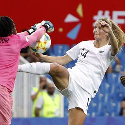 Cameroon goalkeeper Annette Ngo Ndom, left, makes a save against New Zealand's Katie Bowen during the Women's World Cup Group E soccer match between Cameroon and New Zealand at the Stade de la Mosson in Montpellier, France, Thursday, June 20, 2019. (AP Photo/Claude Paris)