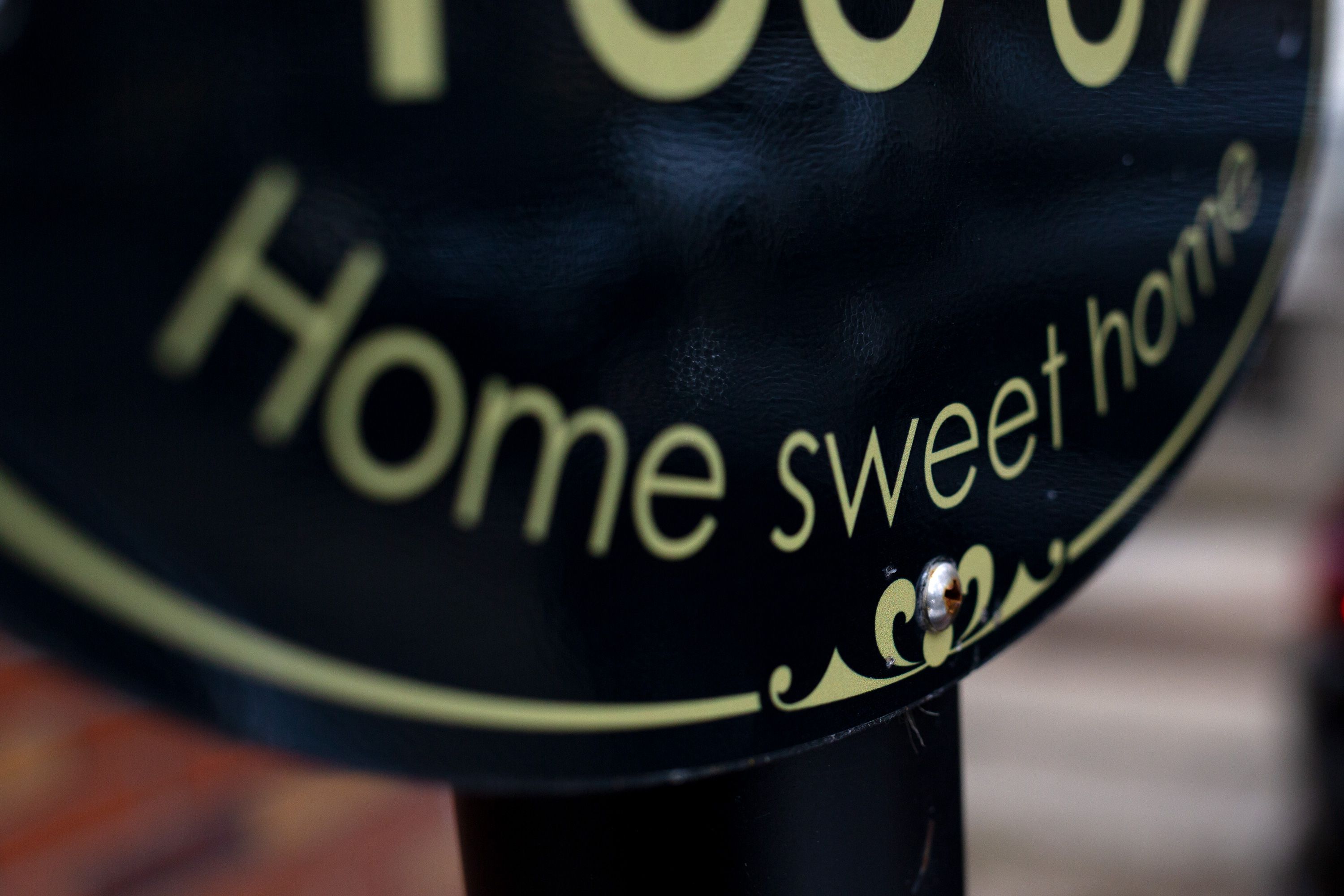 A sign reads “Home sweet home” at the Jamaica, Queens, address where Dawn Peterson was fatally shot.