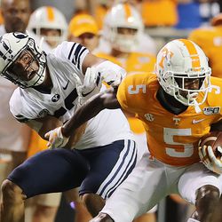 Brigham Young Cougars linebacker Isaiah Kaufusi (53) tries to tackle Tennessee Volunteers wide receiver Josh Palmer (5) as BYU and Tennessee play a game in Knoxville on Saturday, Sept. 7, 2019. BYU won 29-26 in double overtime.