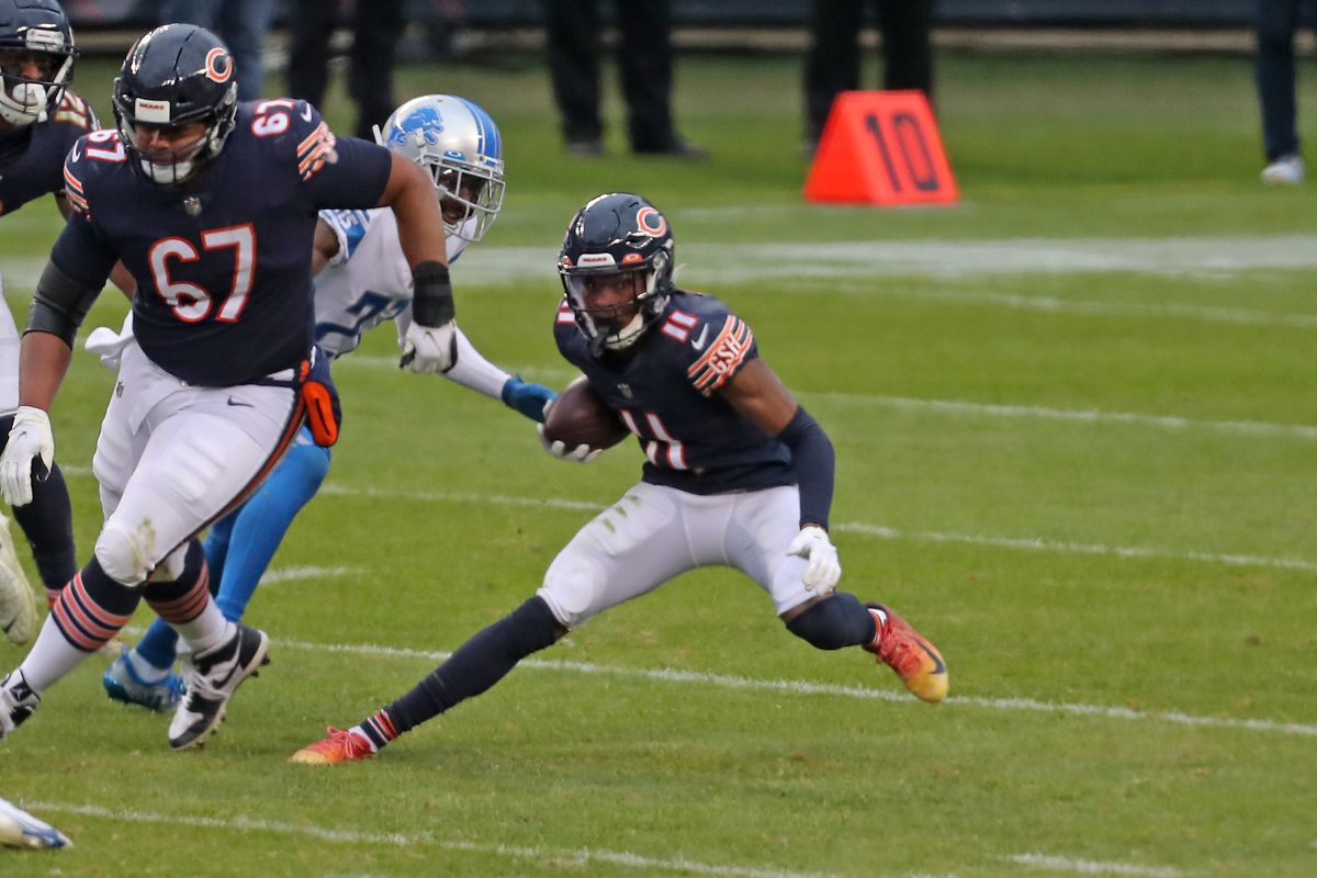 Chicago Bears wide receiver Darnell Mooney (11) runs with the ball during the second half against the Detroit Lions at Soldier Field.