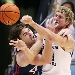 Brigham Young Cougars forward Caleb Lohner (33) and Saint Mary’s Gaels guard Alex Ducas (44) get tangled up in Provo on Saturday, Jan. 8, 2022.