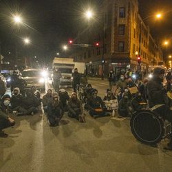 Activists occupy the intersection of Milwaukee, Diversey and Kimball during a protest and rally Thursday, March 4, 2021, against a General Iron plant being relocated to the Southeast Side of Chicago.