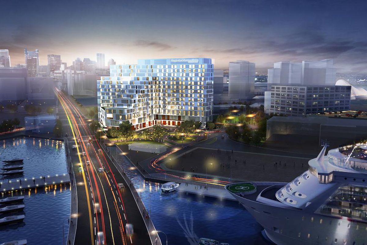 Rendering of a multi-story hotel complex on a waterfront, with a highway zipping through.