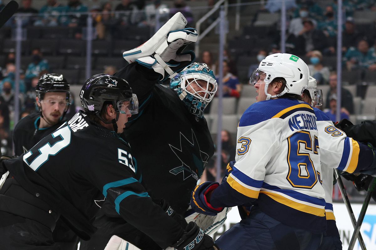 Adin Hill #33 of the San Jose Sharks gets into a fight with Jake Neighbours #63 of the St. Louis Blues at SAP Center on November 04, 2021 in San Jose, California.