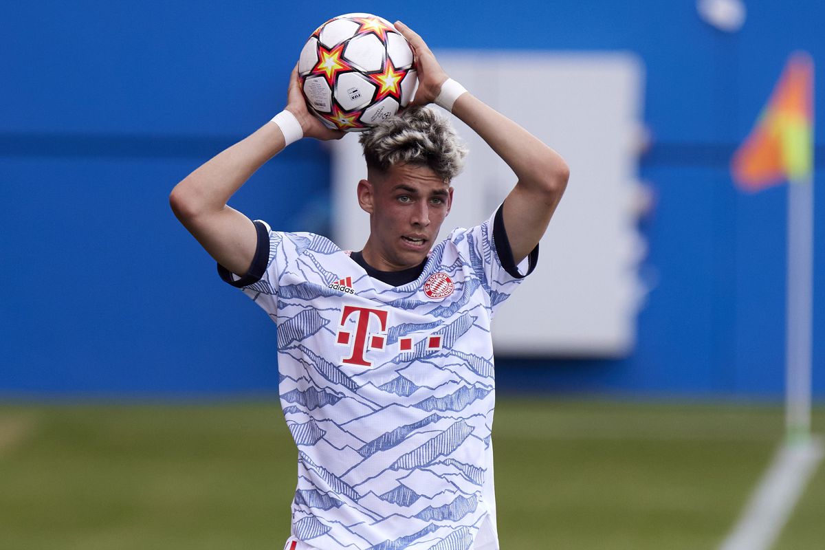 Nick holds the ball over his head for a throw-in in the UEFA Youth League