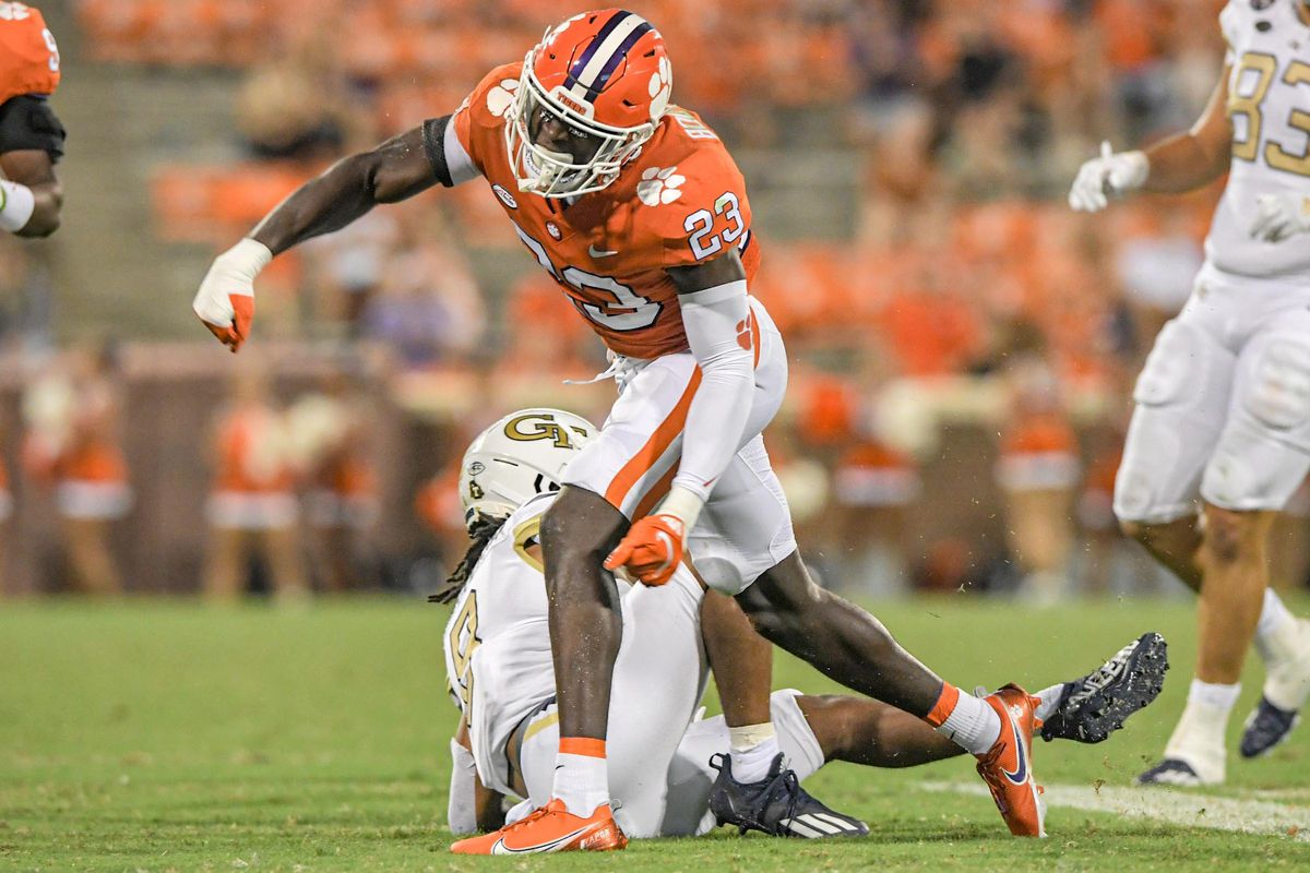 Clemson cornerback Andrew Booth Jr. (23) reacts after tackling Georgia Tech freshman Jahmyr Gibbs (1) during the fourth quarter in Clemson, S.C., September 18, 2021.