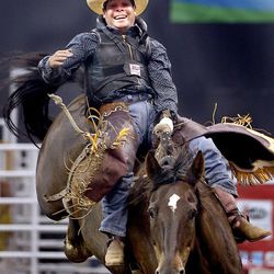 Cody DeMers of Kimberly, ID, competes in bareback riding at the Days of '47 Rodeo at EnergySolutions Arena in Salt Lake City on Friday, July 25, 2014.