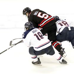 UConn's Brian Rigali (19) & Max Kalter (18) during the Northeastern Huskies vs UConn Huskies men's college ice hockey game game at the XL Center in Hartford, CT  on November 28, 2017.