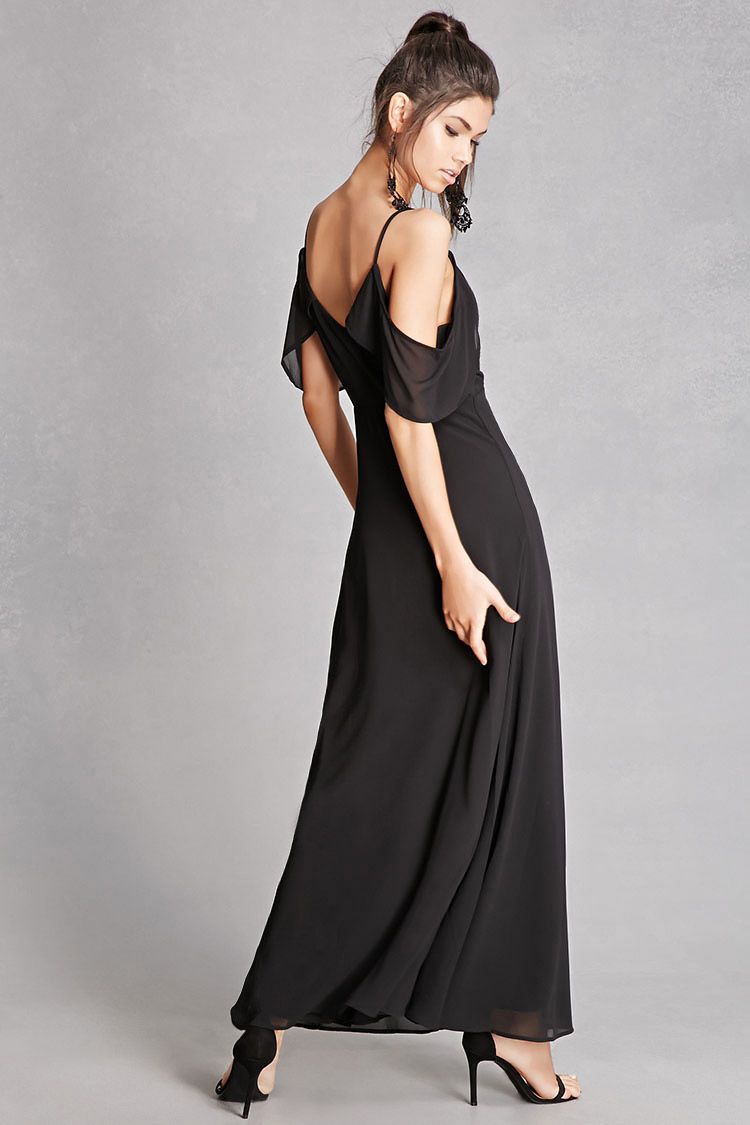 Model in black exposed shoulder dress.