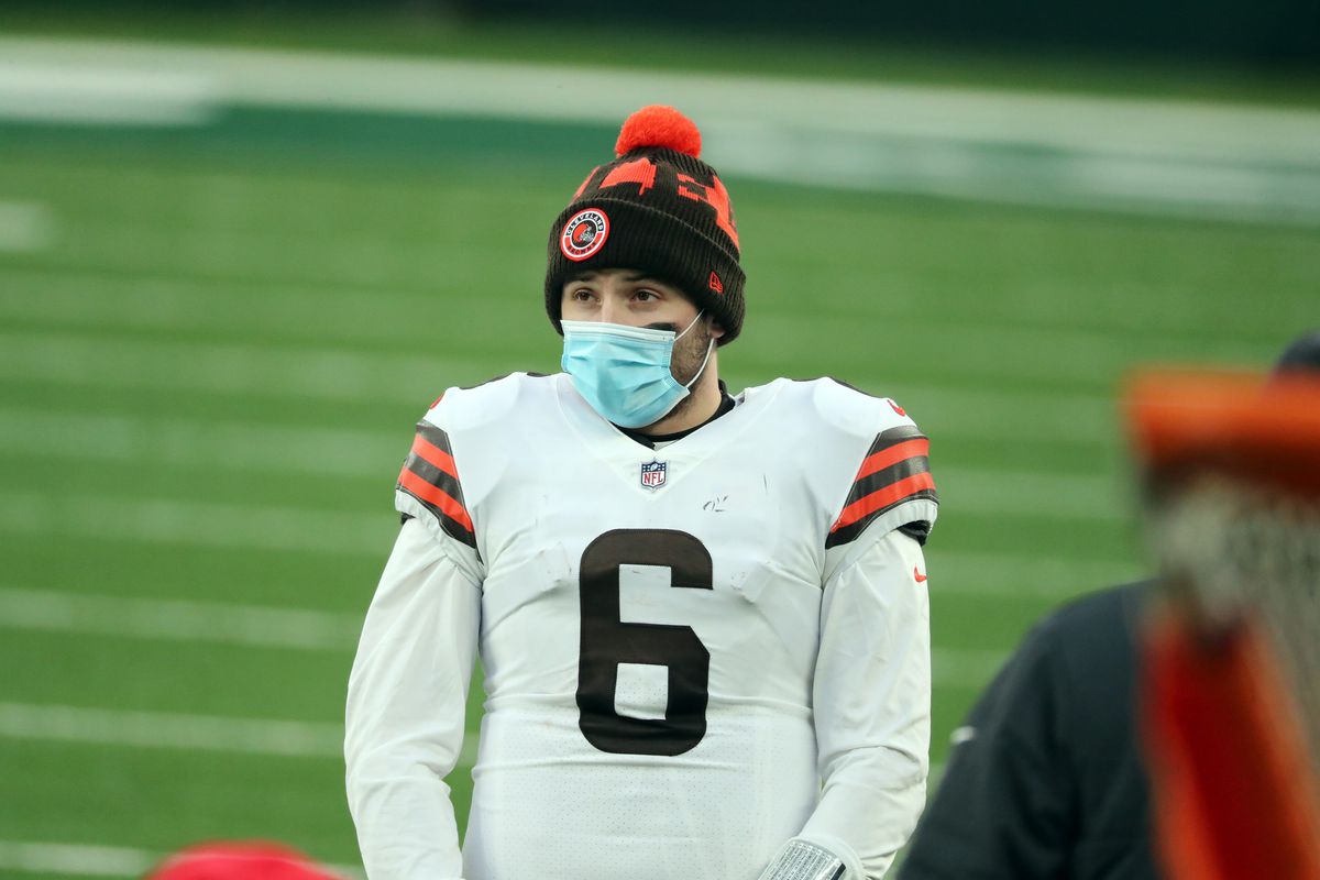 Baker Mayfield #6 of the Cleveland Browns wears a PPE face maske as he follows the action against the New York Jets at MetLife Stadium on December 27, 2020 in East Rutherford, New Jersey.