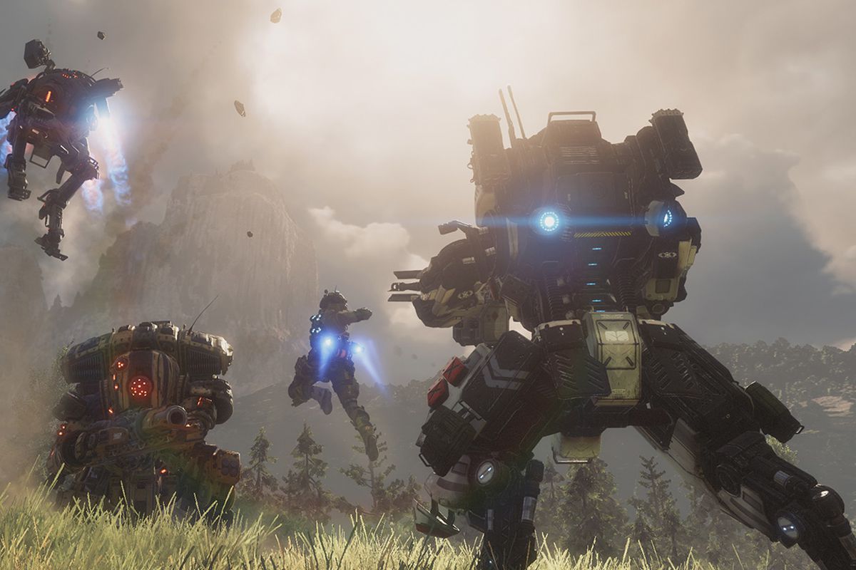 Titans and pilots fight in a grassy field in a screenshot from Titanfall 2