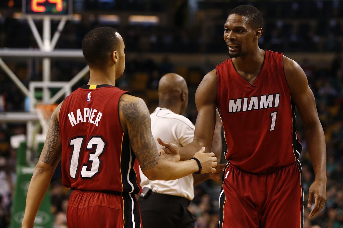 Chris Bosh (right) wishes his teammates luck without him. He's out for the season...