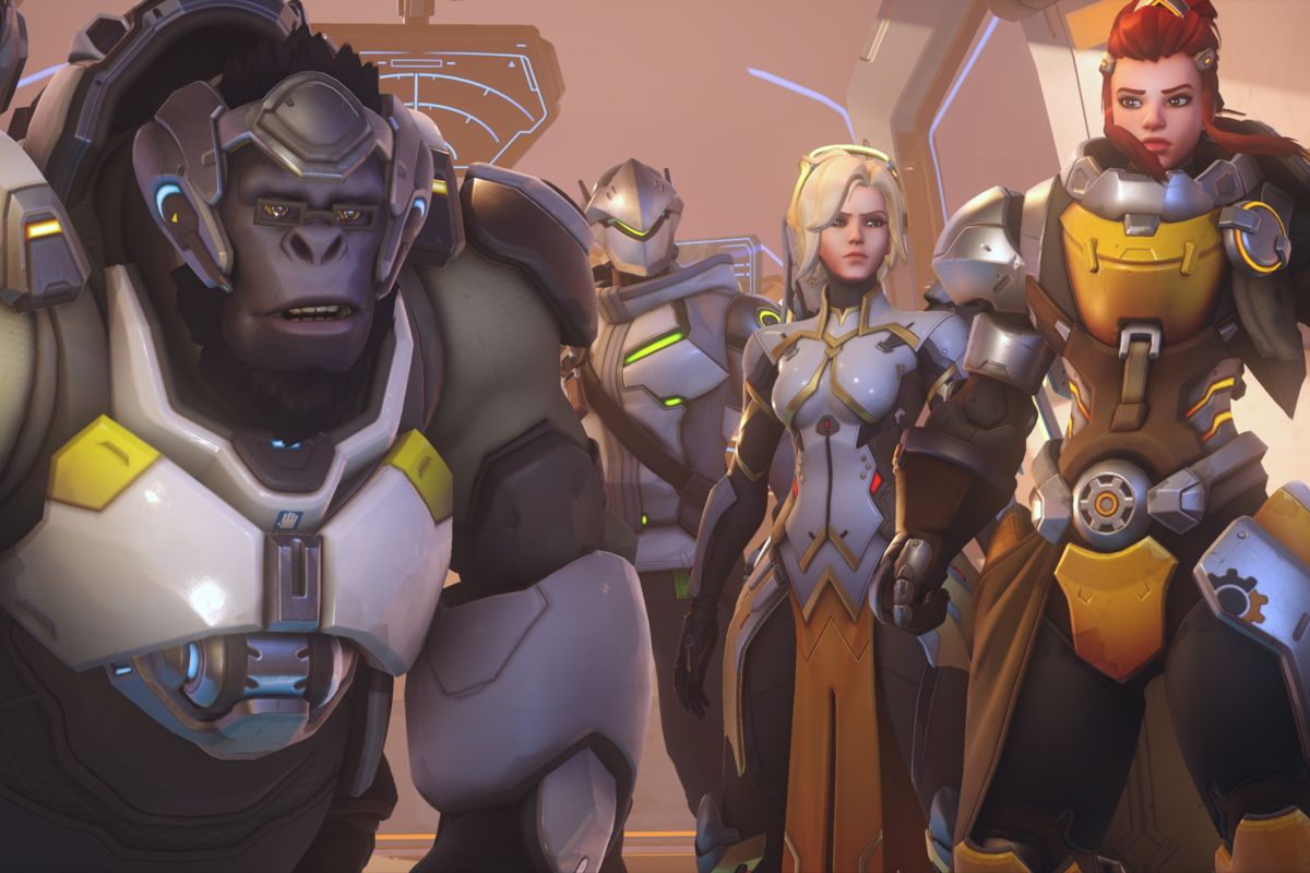 Winston, Genji, Mercy, and Brigitte stand side by side in their default costumes in a still from Overwatch 2