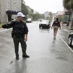Charleston, S.C. Police Department blocks the street during an active hostage situation in Charleston, S.C., on Thursday, Aug.24, 2017. Authorities say a disgruntled employee shot one person and is holding hostages in a restaurant in an area that is popular with tourists. Mayor John Tecklenburg said at a news conference that the shooting was not an act of terrorism or racism.