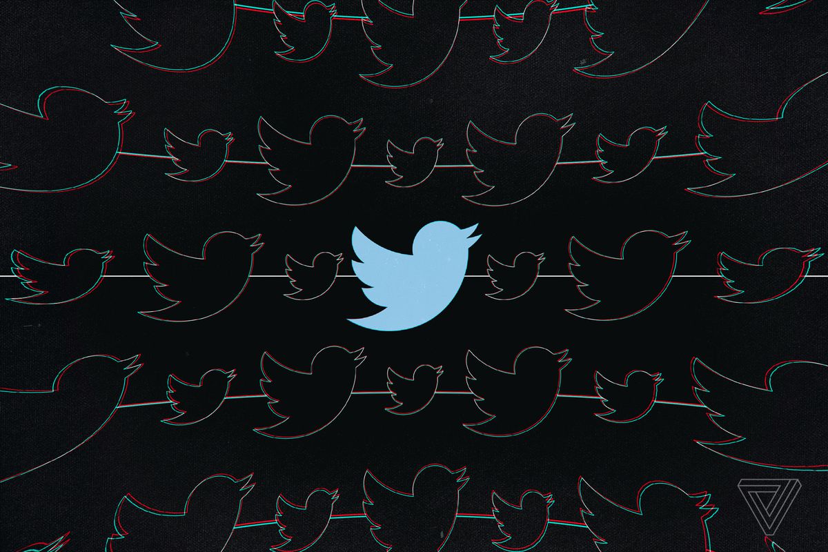 Twitter’s blue bird silhouette logo on a black background.