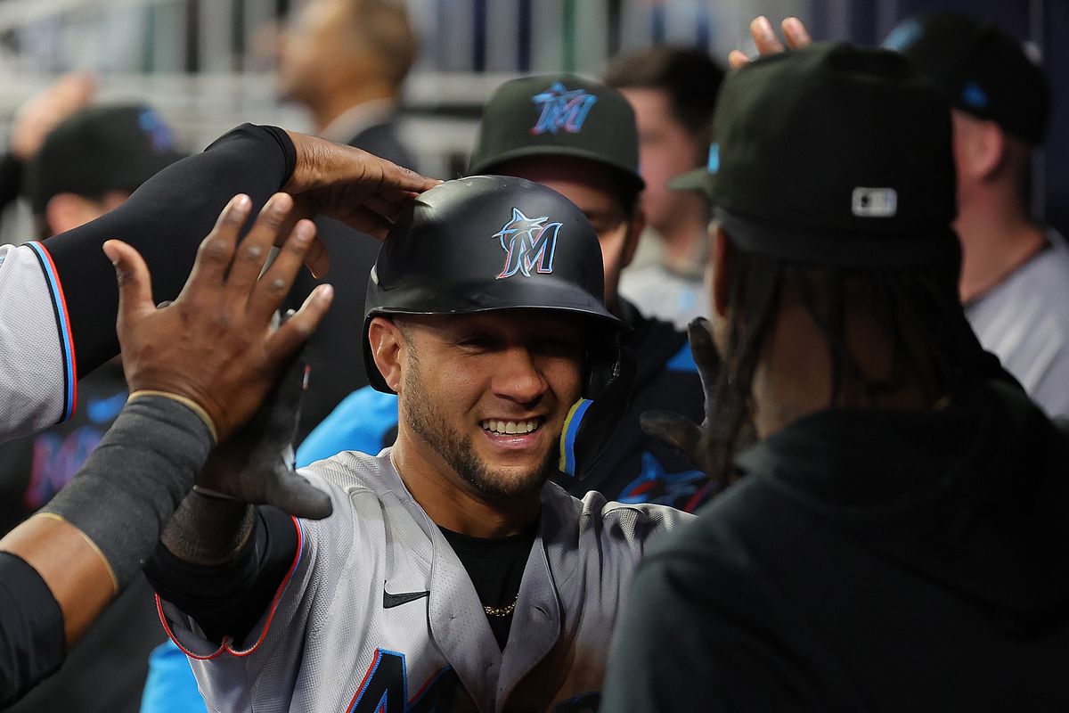 Yuli Gurriel #10 of the Miami Marlins celebrates hitting an inside-the-park home run in the ninth inning against the Atlanta Braves at Truist Park on April 25, 2023 in Atlanta, Georgia.