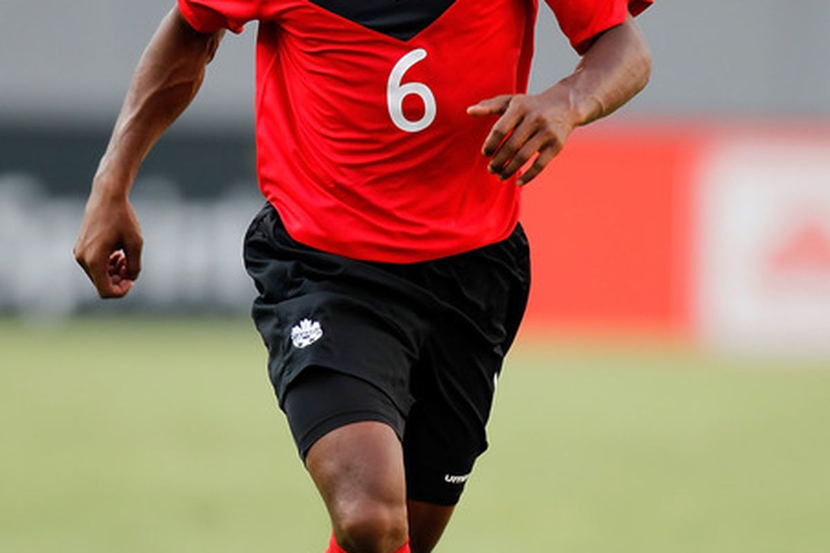 TAMPA, FL - JUNE 11:  Julian De Guzman #6 of Team Canada advances the ball against Team Guadeloupe during the CONCACAF Gold Cup Match at Raymond James Stadium on June 11, 2011 in Tampa, Florida.  (Photo by J. Meric/Getty Images)