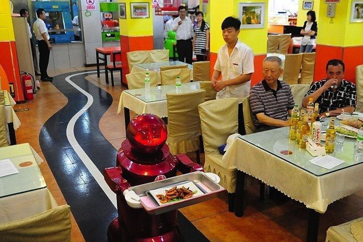<span class="credit"><em>[Photo: <a href="http://www.dailymail.co.uk/sciencetech/article-2165339/Serving-humanity-diner-time-Chinese-restaurant-robot-staff-delights-noodle-lovers.html">Rex Features</a>]</em></span>