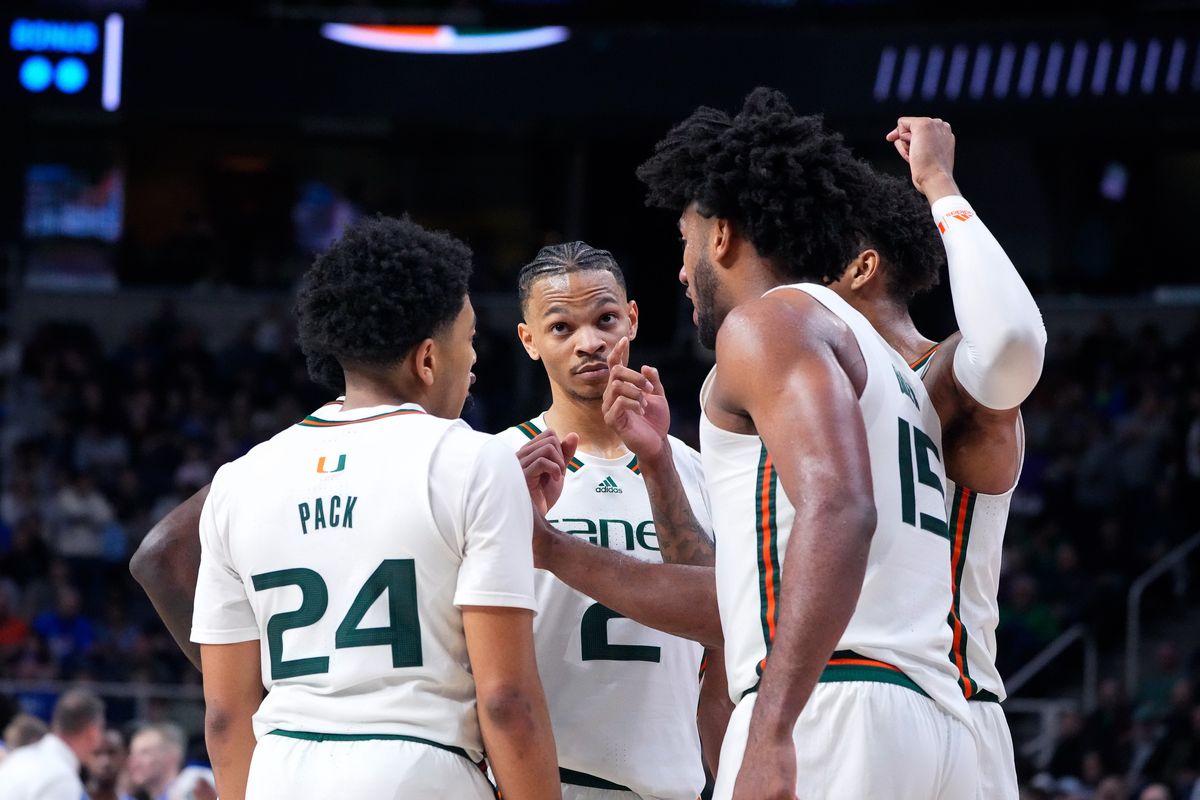 Miami Hurricanes guard Nijel Pack and guard Isaiah Wong and guard Jordan Miller and forward Norchad Omier talk during a timeout in the second half against the Drake Bulldogs at MVP Arena.