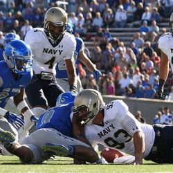 Air Force and Navy scrum for a ball