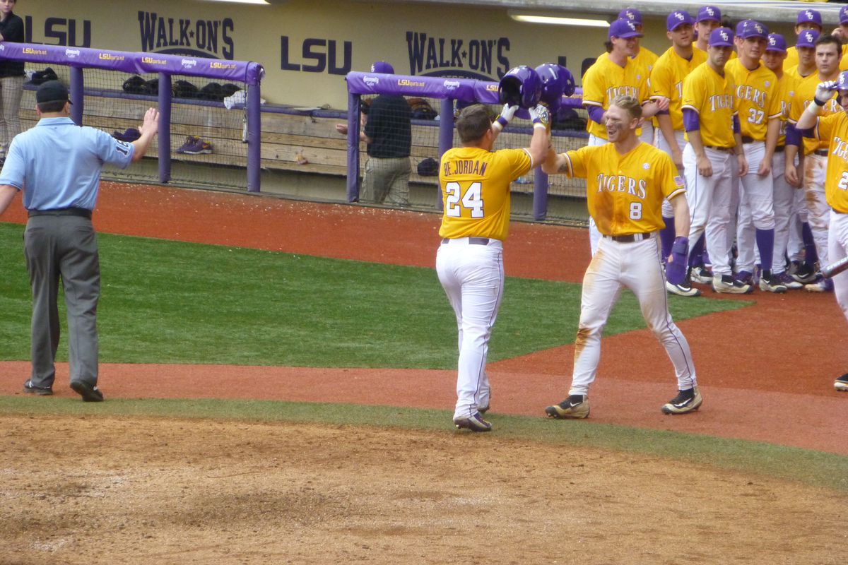 Beau Jordan is greeted by Jake Fraley following his home run during Sunday's onslaught.