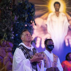 Father Michael Pfleger celebrates Mass for the first time since January after he was reinstated as senior pastor of the Faith Community of Saint Sabina in Auburn Gresham, Sunday, June 6, 2021. The Archdiocese of Chicago cleared Pfleger to return to the South Side church after an internal probe into decades-old allegations of sexual abuse against minors.