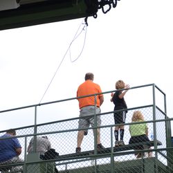 1:04 p.m. Line for the LF video board net tied off to the railing, in the back row of the bleachers - 