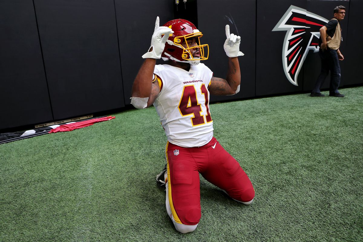 J.D. McKissic #41 of the Washington Football Team reacts after scoring a touchdown during the fourth quarter in the game against the Atlanta Falcons at Mercedes-Benz Stadium on October 03, 2021 in Atlanta, Georgia.