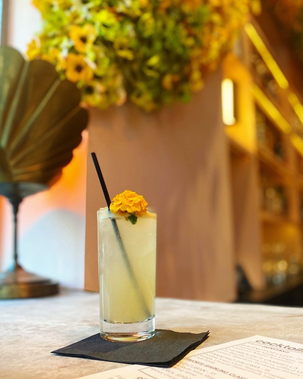 Paradiso Paloma with silver tequila, grapefruit juice, Strega, Chinola passionfruit, lime, and topped with club soda. 