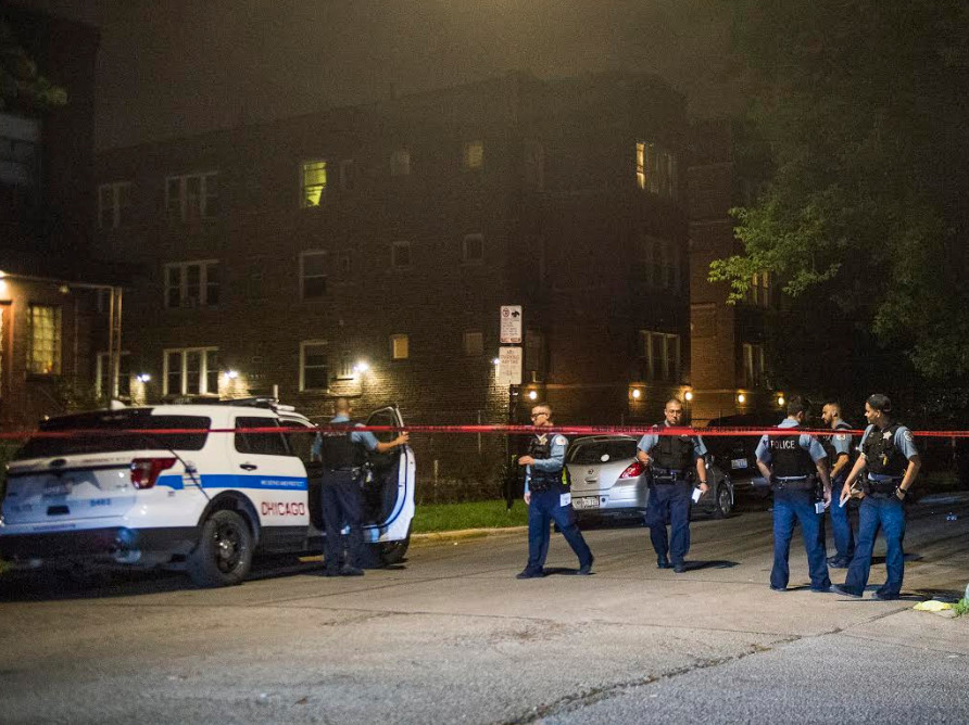 Police investigate the shooting of a man and a boy early Tuesday in the Humboldt Park neighborhood | Tyler LaRiviere/Sun-Times