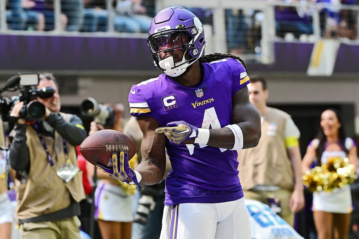 Running back Dalvin Cook #4 of the Minnesota Vikings reacts after gaining a first down in the second quarter of the game against the Detroit Lions at U.S. Bank Stadium on September 25, 2022 in Minneapolis, Minnesota.