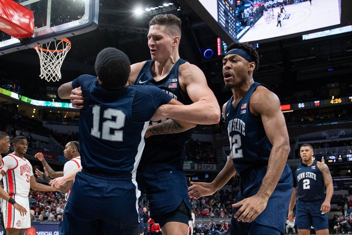 Penn State Nittany Lions guard Sam Sessoms (12) and forward John Harrar (21) and guard Jalen Pickett (22) celebrate in the second half against the Ohio State Buckeyes at Gainbridge Fieldhouse.&nbsp;