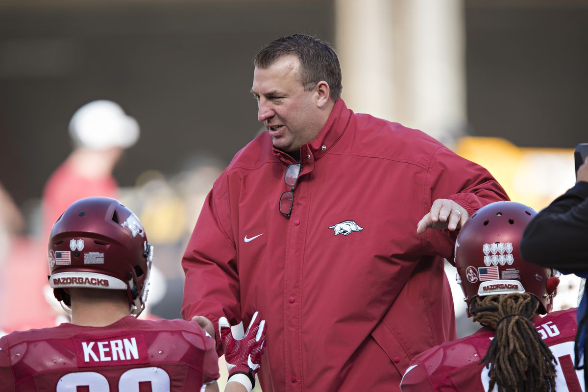 Head Coach Bret Bielema of the Arkansas Razorbacks greets players before a game against the Missouri Tigers at Razorback Stadium on November 24, 2017 in Fayetteville, Arkansas. The Tigers defeated the Razorbacks 48-45.