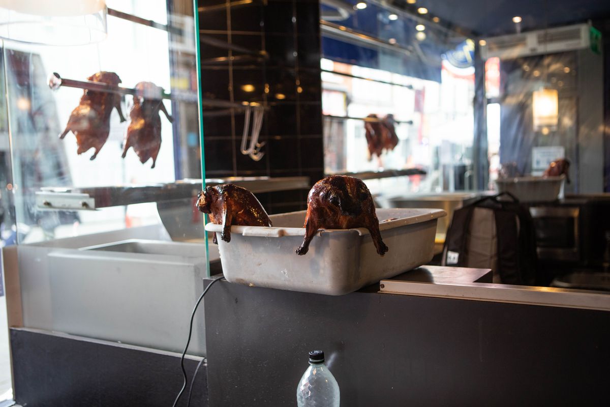 Roast ducks hang inside Old Town 97 in London’s Chinatown on the day restaurants resumed outdoor dining