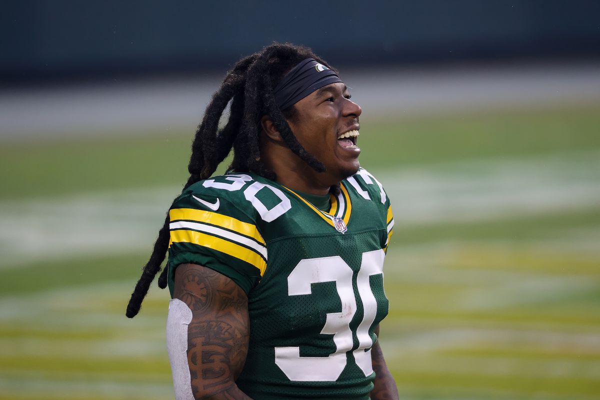Jamaal Williams #30 of the Green Bay Packers reacts before the game against the Los Angeles Rams during the NFC Divisional Playoff game at Lambeau Field on January 16, 2021 in Green Bay, Wisconsin.