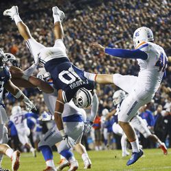 Brigham Young Cougars defensive lineman Corbin Kaufusi (90) tries to block a punt by Boise State Broncos kicker Joel Velazquez (46) in Provo on Friday, Oct. 6, 2017.