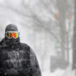 Guy Cournoyer of Northampton adds some color to an otherwise white-out day in downtown Northampton, Mass., Monday, Feb. 2, 2015. Cournoyer says the combination of ski goggles and a full head-covering balaclava leaves no exposed skin. 