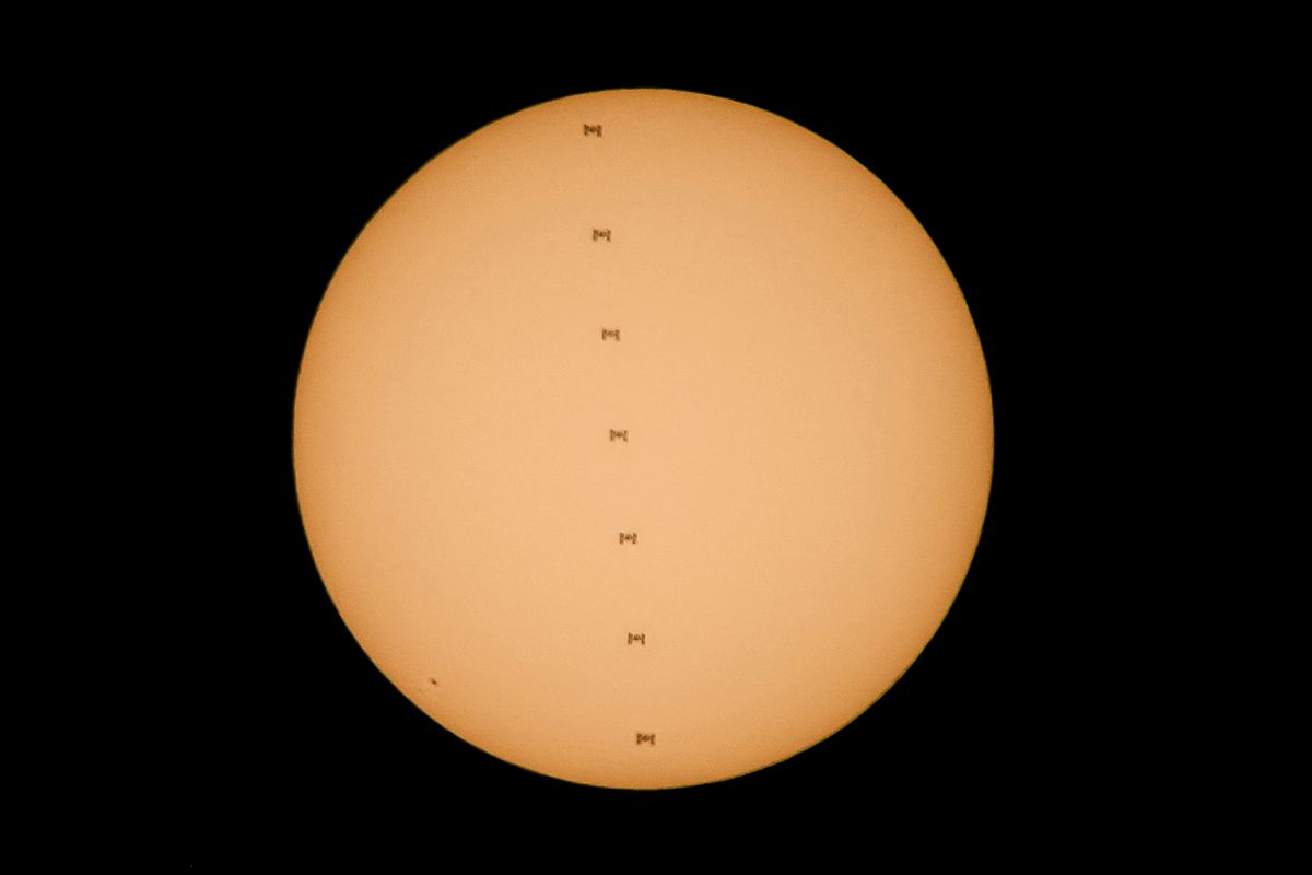 This composite of seven images taken in less than one second shows the International Space Station in silhouette against the sun as it passes above the Deseret News in Salt Lake City on Thursday, July 6, 2017.