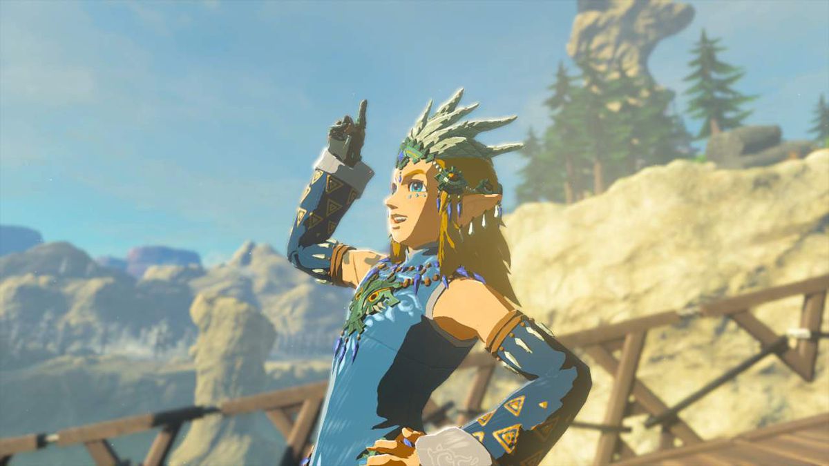 Link poses pointing up with a smile on his face wearing the full Frostbite Armor set in Zelda: Tears of the Kingdom