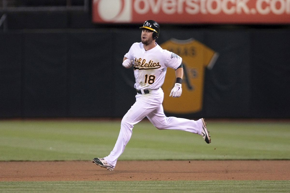 July 30, 2012; Oakland, CA, USA; Oakland Athletics shortstop Brandon Hicks (18) rounds the bases on a solo home run against the Tampa Bay Rays during the seventh inning at O.co Coliseum. Mandatory Credit: Kelley L Cox-US PRESSWIRE