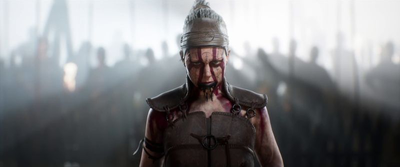 Senua with army and white light behind her in Senua’s Saga: Hellblade 2
