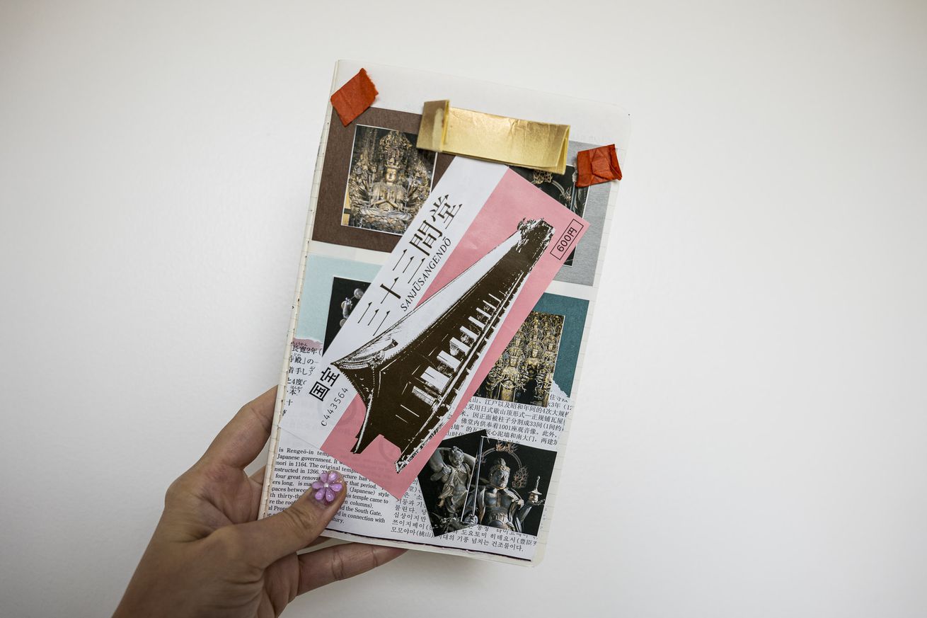 Scrapbook page with ticket stubs, photos, and pamphlet sections arranged in a notebook.