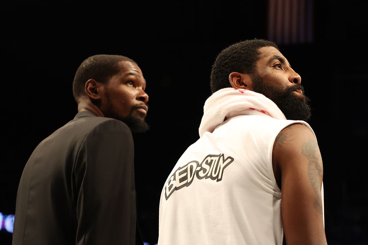 Kevin Durant and Kyrie Irving of the Brooklyn Nets look on during their game against the Milwaukee Bucks at Barclays Center on January 18, 2020 in New York City.