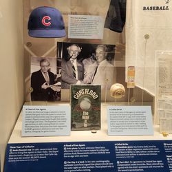 A Cubs cap in an exhibit on early free agency/collusion