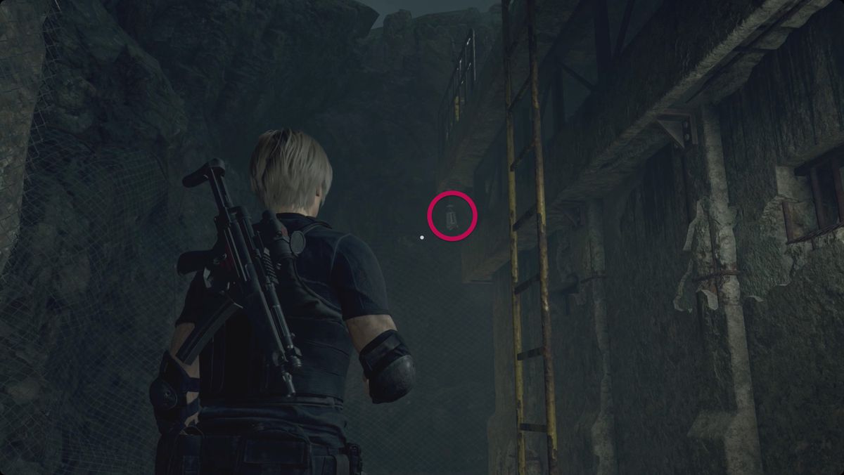 Resident Evil 4 remake Leon looking at a treasure lantern behind the first gun emplacement