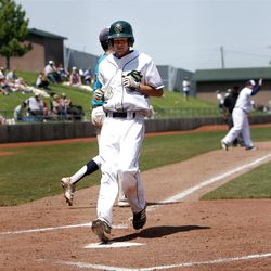 Snow Canyon's #3 Austin Ovard steps on home plate as Snow Canyon and Juan Diego play in the second of two games Saturday, May 19, 2012 to determine the 3A state championship at Gates field in Kearns. Snow Canyon won 5-1 to claim the championship.