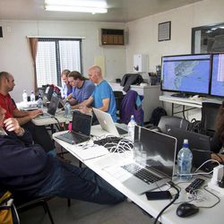 In this June 12, 2013 photo released by Google, Google's team at mission control monitors a balloon launch in Christchurch, New Zealand. Google is testing the balloons which sail in the stratosphere and beam the Internet to Earth. 