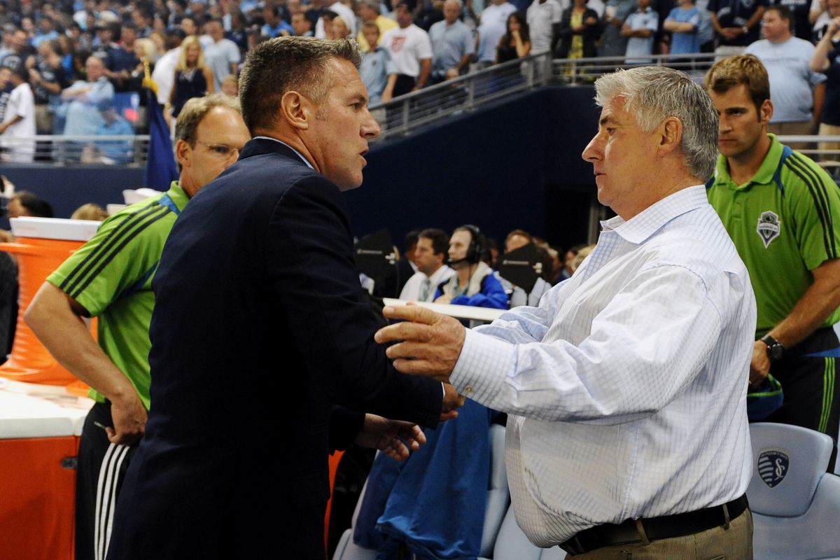 Aug 8, 2012; Kansas City, KS, USA; Sporting KC coach Peter Vermes (left) talks to Seattle Sounders coach Sigi Schmid (right) before the game at Livestrong Sporting Park. Mandatory Credit: John Rieger-US PRESSWIRE