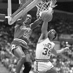 Michael Jordan dunks off Darrell Griffith.